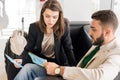 Couple Waiting in Airport Royalty Free Stock Photo