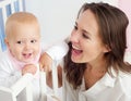 Portrait of a beautiful mother with cute baby smiling