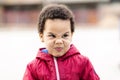 Portrait of a beautiful multi racial boy making silly face