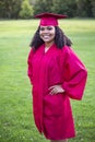 Portrait of a beautiful multiethnic woman in her graduation cap and gown