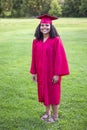 Portrait of a beautiful multiethnic woman in her graduation cap and gown