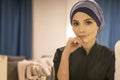 Portrait of a beautiful muslim woman at a table in a cafe Royalty Free Stock Photo