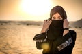 Portrait of beautiful Muslim woman wearing Hijab in the desert. Royalty Free Stock Photo