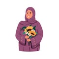 Portrait of a beautiful muslim woman wearing purple hijab and holding bouquet of flowers Royalty Free Stock Photo