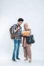 Portrait of beautiful muslim women explaining project on book to his partner