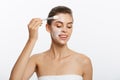 Portrait beautiful naked woman apply cosmetic white clay mask on with brush. Isolated on a white background. concept of Royalty Free Stock Photo