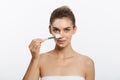 Portrait beautiful naked woman apply cosmetic white clay mask on with brush. Isolated on a white background. concept of Royalty Free Stock Photo