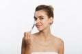 Portrait beautiful naked woman apply cosmetic white clay mask on with brush. Isolated on a white background. concept of Royalty Free Stock Photo