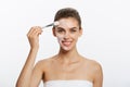 Portrait beautiful naked woman apply cosmetic white clay mask on with brush. Isolated on a white background. concept of Royalty Free Stock Photo