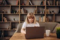 Portrait of beautiful older woman working laptop computer indoors Royalty Free Stock Photo