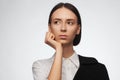 Portrait of a beautiful pacified woman in a white shirt and black jacket. Studio photo session