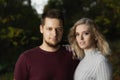 Portrait of beautiful pair of young man and woman posing outdoors Royalty Free Stock Photo