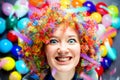 Portrait of beautiful party woman in wig and glasses Carneval