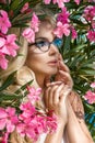 Portrait beautiful phenomenal stunning elegant blonde model woman with perfect face wearing a glasses stands with elegant out Royalty Free Stock Photo