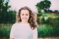 Portrait Of Beautiful Plus Size Young Woman In White Shirt Posing In Summer Field Meadow At Sunset Background Royalty Free Stock Photo