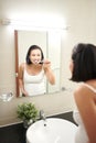 Portrait of beautiful pregnant woman brushing teeth at bathroom Royalty Free Stock Photo
