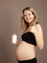 Portrait of a beautiful pregnant woman with glass of milk. Breakfast. The concept of useful diet pregnant Royalty Free Stock Photo