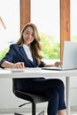 Beautiful Asian businesswoman in her office, working on her business task