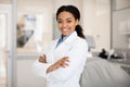 Portrait Of Beautiful Professional Black Female Stomatologist Posing In Clinic Interior