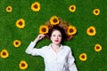 Portrait of beautiful red-haired girl with sunflowers Royalty Free Stock Photo