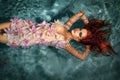 Portrait of red-haired girl in the water Royalty Free Stock Photo