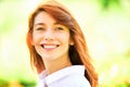 Portrait of a beautiful red-haired smiling girl. Red head female model.