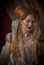 Portrait of beautiful red haired woman dressed in period costume as Elizabeth I Royalty Free Stock Photo