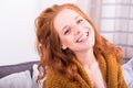 Portrait beautiful red-haired woman in orange cardigan Royalty Free Stock Photo