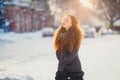 Portrait beautiful redhair girl in frosty winter weather.