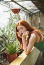 Portrait a beautiful redheaded woman in dress