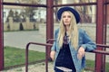 Portrait of a beautiful sad blonde girl outdoors in hat Royalty Free Stock Photo