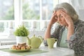 Portrait of beautiful sad senior woman drinking tea Royalty Free Stock Photo