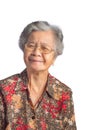 Portrait of a beautiful senior Asian woman wearing glasses with short white hair smiling and looking at the camera while standing Royalty Free Stock Photo