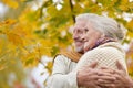 Portrait of beautiful senior couple hugging in the park Royalty Free Stock Photo