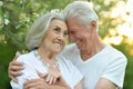 Portrait of beautiful senior couple hugging in the park Royalty Free Stock Photo