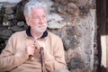 Portrait of beautiful senior man sitting outdoors Royalty Free Stock Photo