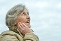 Beautiful senior woman against blue sky Royalty Free Stock Photo