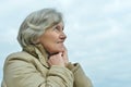 Beautiful senior woman against blue sky Royalty Free Stock Photo