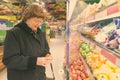 Beautiful senior woman shopping at the grocery store Royalty Free Stock Photo