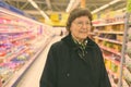 Beautiful senior woman shopping at the grocery store Royalty Free Stock Photo