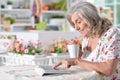 Beautiful senior woman using tablet at home Royalty Free Stock Photo