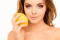 Portrait of beautiful sensitive woman holding lemon near face Royalty Free Stock Photo