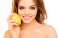 Portrait of beautiful sensitive woman holding lemon near face Royalty Free Stock Photo