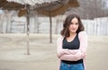 Portrait of beautiful sensitive young girl or woman posing outdoors in casual clothes with smile and adorable eyes