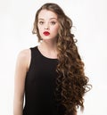 Portrait of a beautiful sensuality woman in black dress with long curly hair