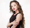 Portrait of a beautiful sensuality woman in black dress with long curly hair