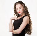 Portrait of a beautiful sensuality woman in black dress with long curly hair