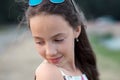 Portrait of beautiful serious teenager girl, looking down