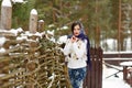 Portrait of beautiful brunette girl in a blue scarf on the Royalty Free Stock Photo