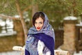 Portrait of beautiful brunette girl in a blue scarf in the Royalty Free Stock Photo